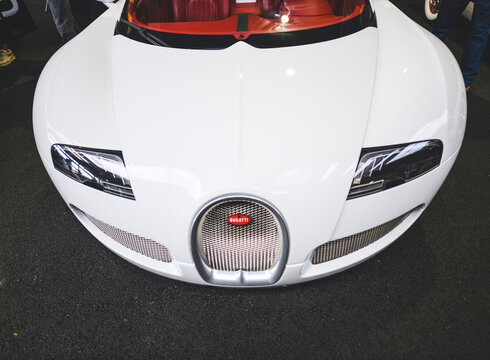 Gothenburg, Sweden - May 30 2026: White Bugatti Veyron roadster front view with red interior.