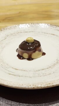 Chef preparing gourmet chocolate hazelnut dessert