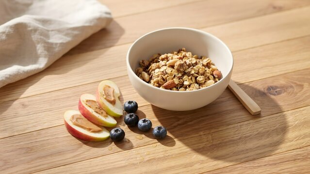 Healthy apple slices with almond butter and blueberries &ndash; Suitable for wellness blogs, clean eating, or morning school snacks.