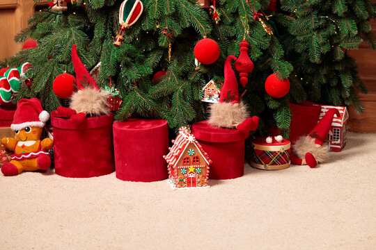 Festive Christmas tree decorated with ornaments gifts gnomes and toys for the holidays
