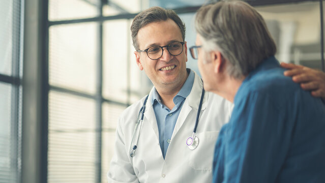 Doctor comforting patient during consultation