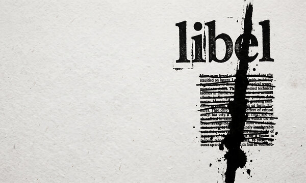 The word libel printed on a page with a thick black ink streak obscuring the text
