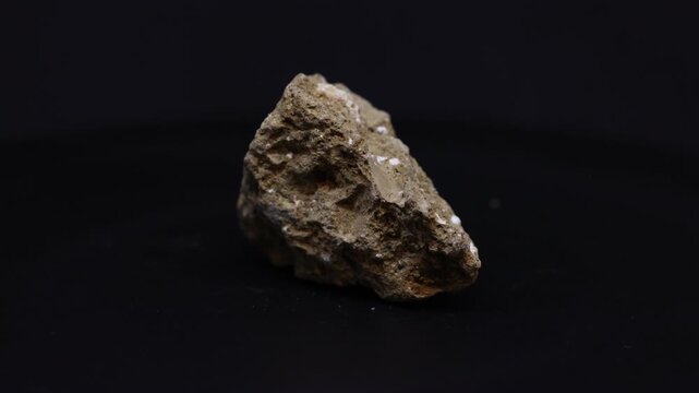 volcanic tuff mineral from Italy with black background