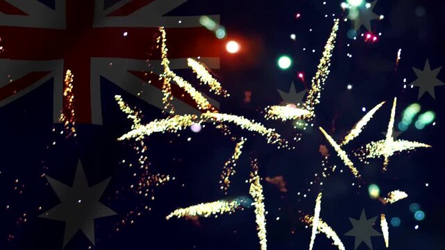 Bright colorful fireworks exploding in the night sky over the australian flag for national celebrations