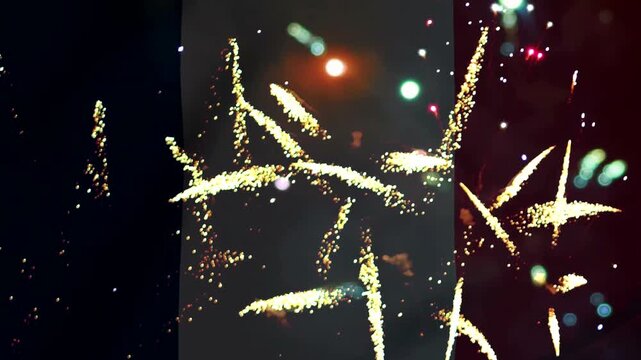 Bright colorful fireworks exploding in the night sky over the flag of france for national celebration