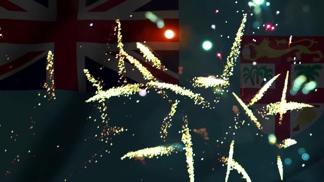 Bright colorful fireworks exploding in the night sky over the national flag of fiji