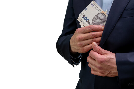 Businessman hiding Ukrainian hryvnia banknotes inside his suit jacket pocket