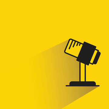 microphone icon with drop shadow on yellow background