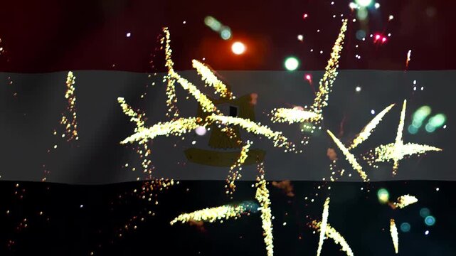 Bright golden fireworks exploding in front of the national flag of Egypt