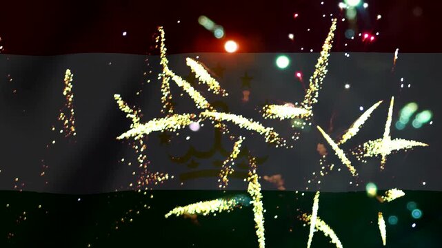 Bright golden fireworks exploding in front of the waving flag of Tajikistan