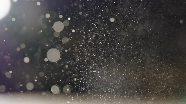 Golden Particles suspended in air with subtle light flares during a gentle breeze