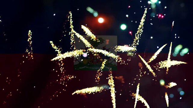 Bright golden fireworks exploding in the night sky over the national flag of Haiti during a celebration