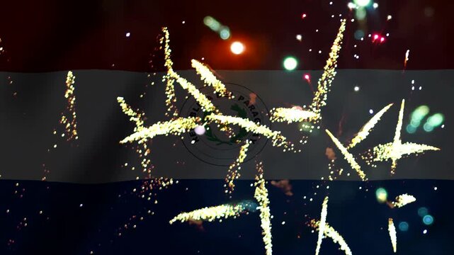 Bright golden fireworks exploding in the night sky over the national flag of Paraguay