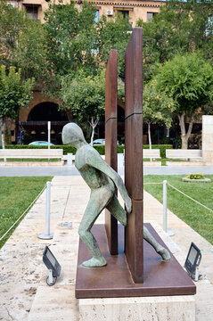The metal sculpture "The Wall" by Belgian artist Guy Bussin in the Cascade Sculpture Garden.
