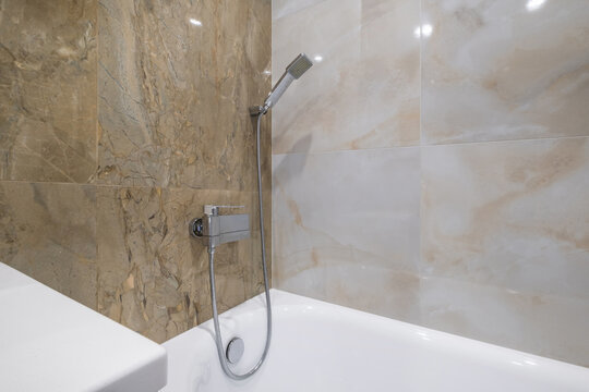  details of corner with water tap sink with faucet with soap and shampoo dispensers in expensive bathroom in rustic eco style