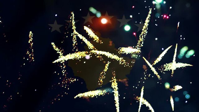 Kosovo map silhouette surrounded by bright festive firework explosions in the night sky during a national celebration