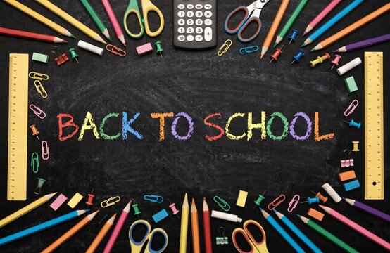 School supplies double border with Back To School written in colorful chalk with against a chalkboard background