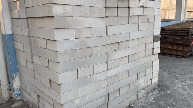 Stacked lightweight concrete blocks texture background on construction site