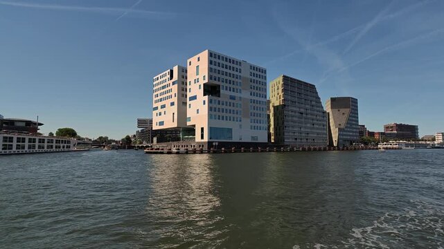 Netherlands - 23 august 2026, Amsterdam: Modern Residential Skyscraper Towers Along IJ Dolly Left