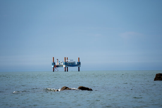 Offshore Platform in Calm Blue Sea Under Clear Sky