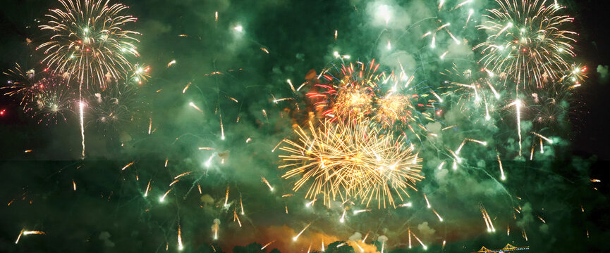 Green firework in night time celebrate national holiday. Green Firework celebrate anniversary happy new year 2024, 4th of july holiday festival. Countdown to new year 2024 festival party background