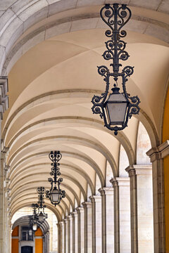 Praca do Comercio Arched Colonnade with Vintage Lanterns in Lisbon Portugal