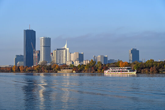 Vienna DC Tower and Donau City Skyline with Cruise Boat on Danube River Austria