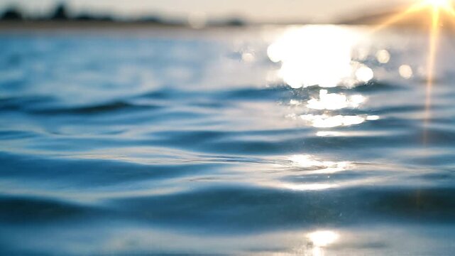 Sparkling Blue Water Surface with Bright Sunlight Reflections Background