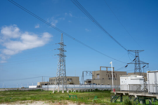 Power Substation with Transmission Towers Under Clear Blue Sky
