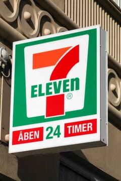 Copenhagen, Denmark - October 4, 2022: 7-Eleven logo on a wall. 7 Eleven is an international chain of convenience stores that operates primarily as a franchise