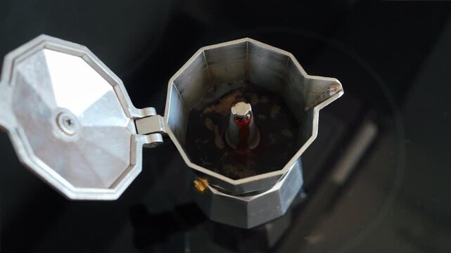 Fresh coffee rising inside a moka pot