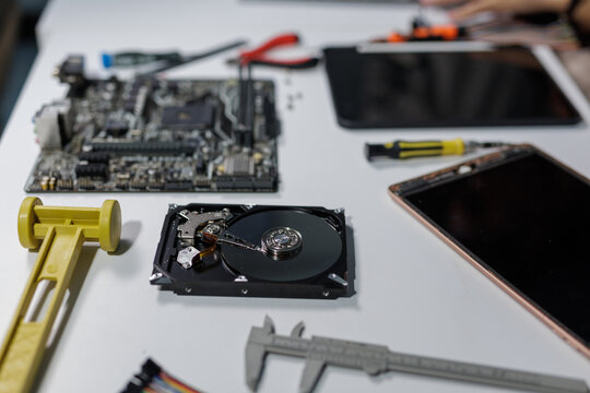 Computer hardware repair work with various tools and components