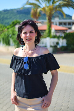 brunette woman tourist exploring a new country on a hot sunny day enjoying her summer vacation travel and discovering foreign culture.