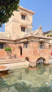 Yogyakarta, Indonesia - August 23, 2026: Historic bathing complex at Taman Sari, a former royal garden and retreat of the Yogyakarta Sultanate, featuring traditional Javanese architecture andstone str