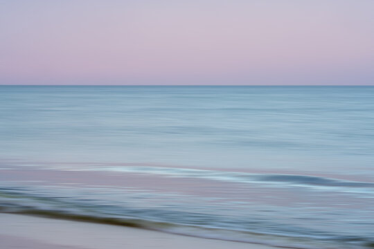 Gentle waves under pastel sky