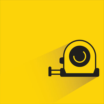 measuring tape icon with shadow on yellow background