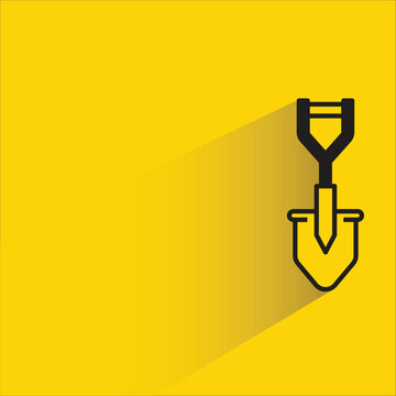 shovel icon with shadow on yellow background