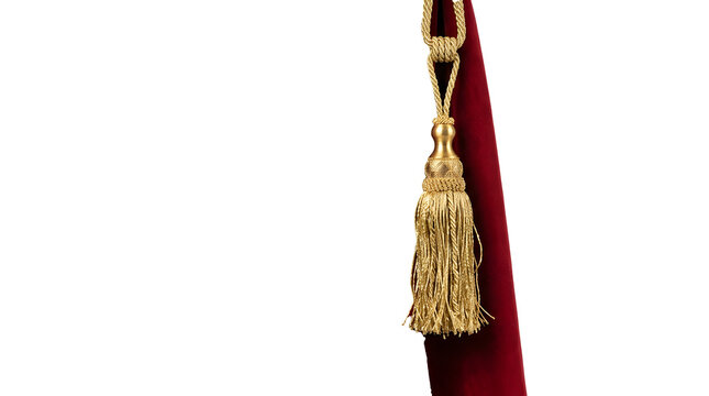 A luxurious red velvet drape featuring an ornate gold tassel hanging against a white background.
