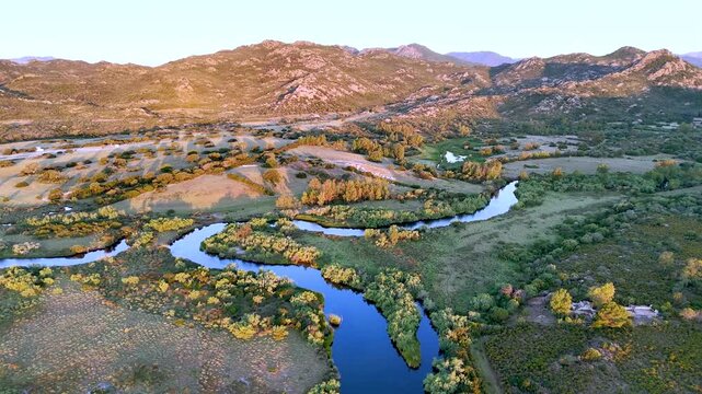 Drone View of River Flowing Toward Berchida Beach in Sardinia
