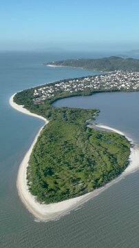 Florian&oacute;polis, Daniela Beach. Aerial View of Tropical Coastline. Establishing Shot. Santa Catarina, Brazil. Vertical video