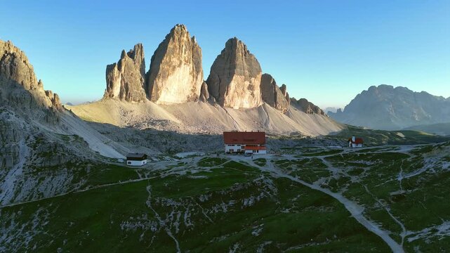 Drone View of Tre Cime Peaks at Sunrise
