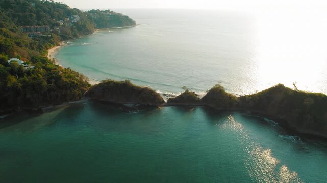 Aerial view of ocean and Playa Mantas coast during sunset in Puntarenas Costa Rica