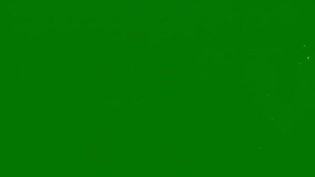 Bright green light streak with sparkling particles moving across a dark background during a subtle camera zoom effect