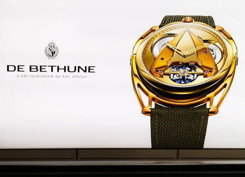 Geneva, Switzerland, Europe - 04.2026 : De Bethune - Swiss brand of luxury futuristic watches, Grand Aiguille d'Or prize for the best watch of the year, advertising board at Geneva Airport arrivals
