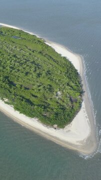 Florian&oacute;polis, Daniela Beach. Aerial View of Tropical Coastline. Establishing Shot. Santa Catarina, Brazil. Vertical video