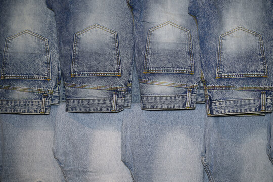 Row of Blue Denim Jeans Hanging in Retail Store