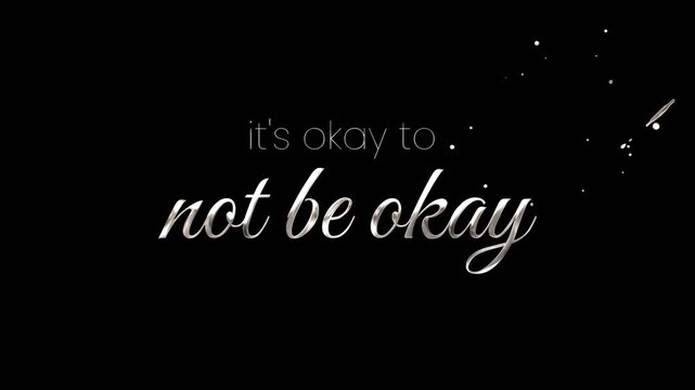 Silver cursive text "its okay to not be okay" on black background with sparkly stars, promoting mental health support. Suitable for inspirational social media posts and message for suicide prevention.