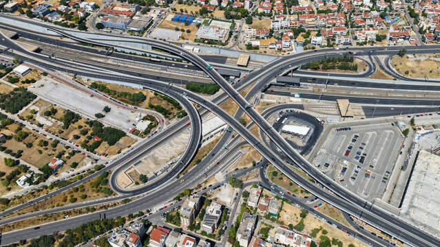 Aerial drone photo of urban multilevel highway junction road using multiple bridges forming a spaggheti road with light traffic