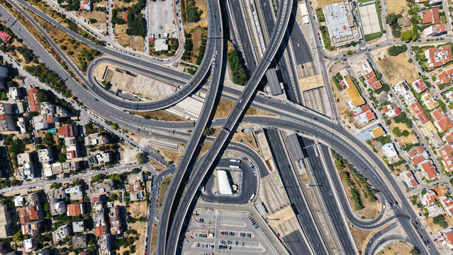Aerial drone photo of popular multilevel highway junction overpass of Attiki Odos road, passing through Doukisis Plakentias Avenue with light traffic, Athens, Attica, Greece