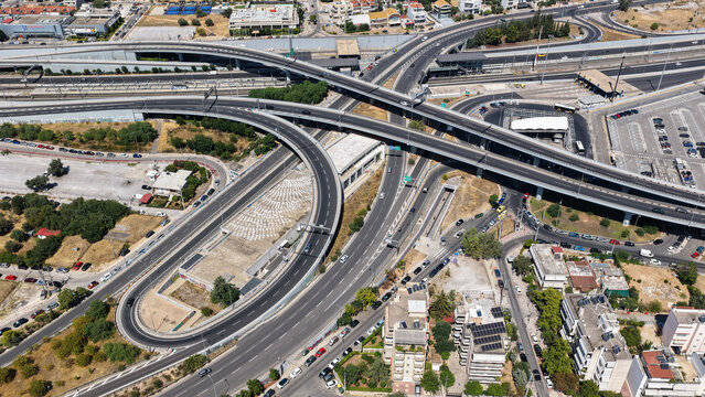 Aerial drone photo of popular multilevel highway junction overpass of Attiki Odos road, passing through Doukisis Plakentias Avenue with light traffic, Athens, Attica, Greece